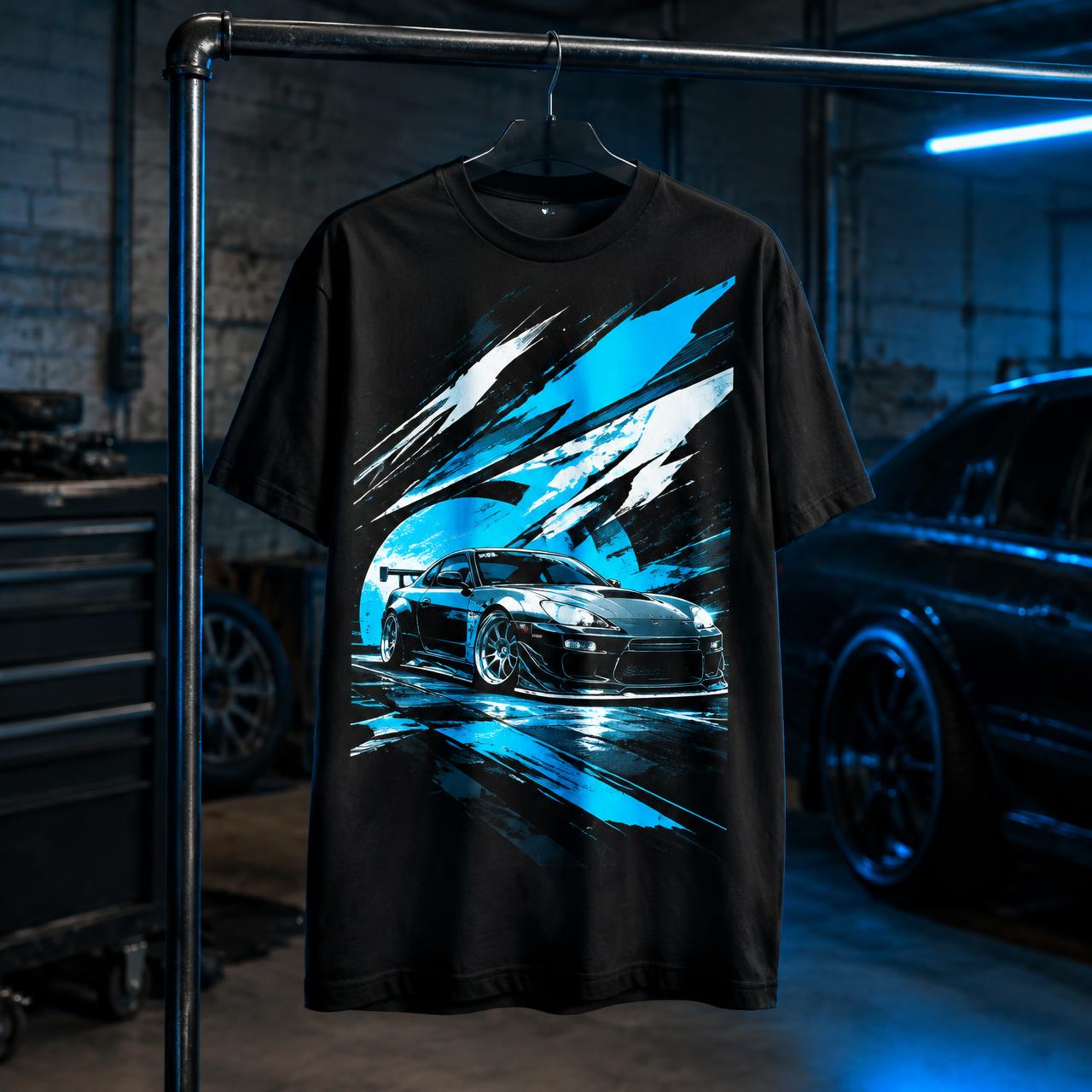 Black Never Stock tee with cyan widebody car graphic hanging in a garage